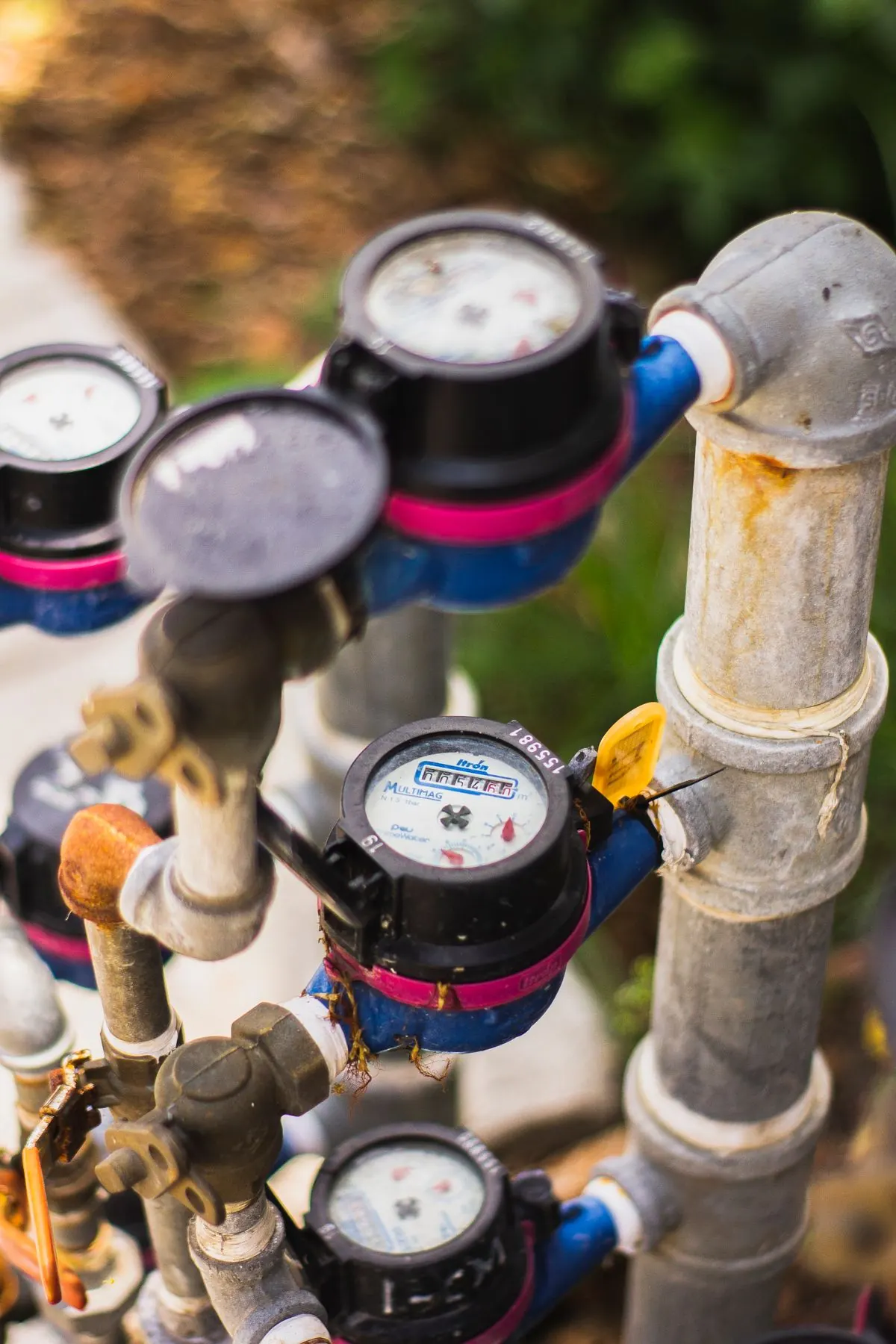 Water meters and backflow assemblies connected by piping
