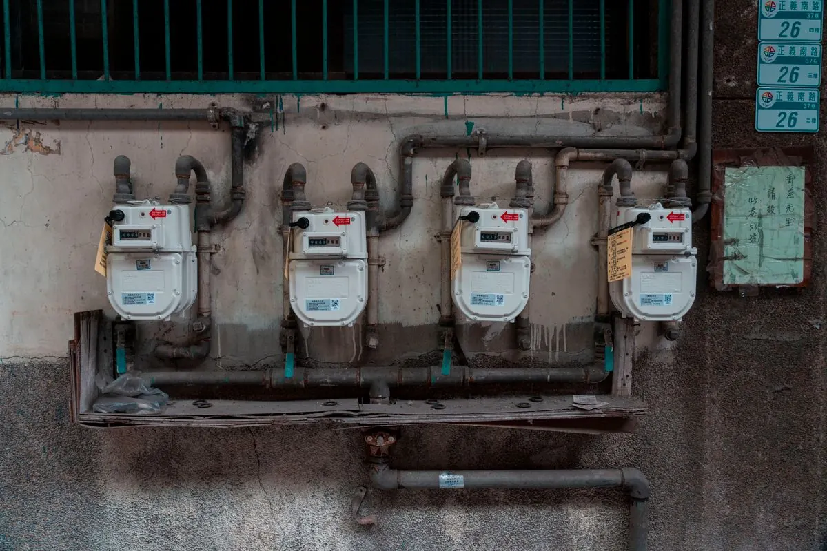 Gas meters and piping on a building wall
